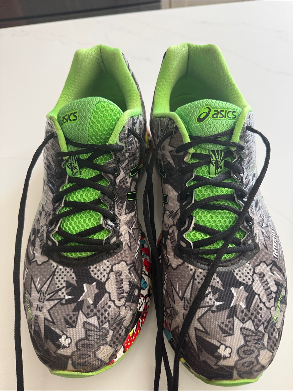 ASICS Men's Gray Graphic Running Shoes with Neon Green Accents used for office